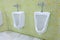 Row of outdoor urinals men public toilet