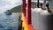 Row of oxygen tanks and diving equipment placed on modern boat in rippling ocean near Koh Tao resort, Thailand. Concept