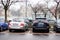 Row of parked cars on parking places in Poznan, Poland.