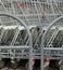 A row of parked shopping carts trolleys