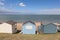 Row of pastel beach huts