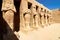 Row of Pharaoh statues in Karnak temple