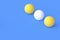 Row of ping pong balls on blue background. Leisure games. International competitions. Sports Equipment