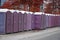 A row of portable rent toilets