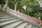 Row of Posts along Stairs with Japanese Writing