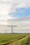 Row of power pylons in a rural Dutch landscape