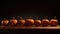 a row of pumpkins sitting on a table