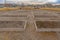 Row of raised beds against homes and sky in Utah