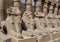 Row of ram-headed sphinxes in front of a row of columns in the first courtyard of the Temple of Amun at Karnak near Luxor, Egypt.