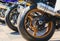 Row of rear wheels of sports bikes in competition