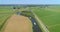 Row of Recreational Boats on a Bendy River in Flat Dutch Landscape - Friesland, The Netherlands, 4K Drone Footage