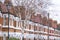 Row of red brick terraced homes