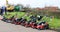 A row of red lawn mowers