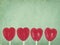 Row of red lollipop hearts on vintage background