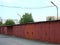 Row of red metal garages in the courtyard