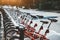 Row of red rental bikes outdoors