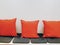 Row of Red Soft Pillows and Cushioning Seats