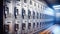 Row upon row of metal school lockers line the corridor