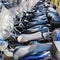 Row of scooters parked roadside