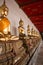 Row of seated Buddhas at the temple of Wat Arun in Bangkok