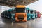 A row of semi trucks parked in a warehouse interior