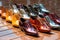 row of shiny polished shoes in various colors