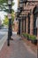 Row of shops along a brick sidewalk in historic Downtown Alexandria, Virginia