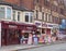 A row of shops neville street in southport merseyside selling ice cream rock beach toys snacks and candyfloss with and amusement