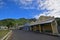 Row of shops with old cowboy design building & quiet main road at Levuka, Ovalau island, Fiji