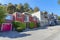 Row of single-family houses with attached garages in a sloped residential area in San Francisco, CA