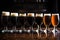 row of six different stout beers in pint glasses