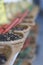 Row of small baskets of tea or spices for sale