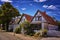 Row of small houses on a cobblestone street as seen in this tourist town. WarnemÃ¼nde