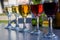 Row of small wine glasses with different wine. Glasses with white, rose and red wine. Wine set. Alcohol drinks concept