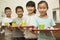 Row of students standing in line in school cafeteria