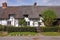 Row of Thatched English Village Cottages