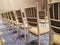 a row of tifany chairs in a hotel ballroom