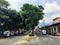 A row of tuk tuks parked along the wide cobblestone boulevard of Antigua, Guatemala