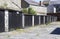 A row of typical lock up rental garages with flat roofs in poor repair in Bangor County Down Northern Ireland