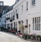 Row of typical mews houses with Juliet balconies in London, UK