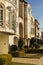 Row of upscale houses showing driveway and yard