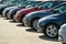 row of used cars. Rental or automobile sale services