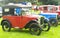 A row of vintage Austin cars.