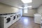 Row of washing machine of laundry business in the public store. Generative AI