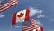 Row of waving flags of Canada and the USA, loopable 3D animation