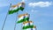 Row of waving flags of India agaist blue sky
