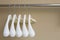 Row of white cloth hangers
