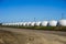 Row of white plastic houses in the form of a ball, Growing of young dairy calves in the nursery