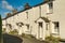 A row of whitewashed cottages in Ambleside, the English Lake Dis