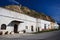 Row of whitewashed hillside cave houses in Gaudix